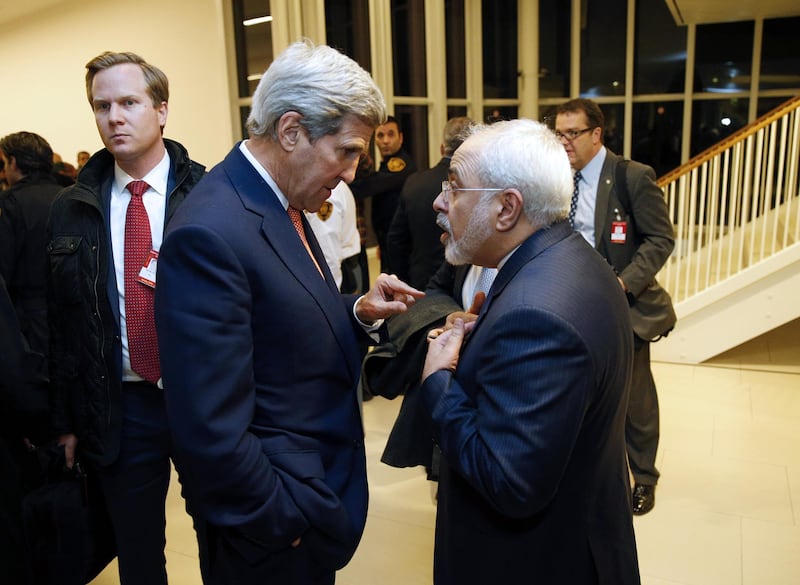 US Secretary of State John Kerry (L) speaks with Iranian Foreign Minister Mohammad Javad Zarif after the International Atomic Energy Agency (IAEA) verified that Iran has met all conditions under the nuclear deal during the E3/EU+3 and Iran talks in Vienna on January 16, 2016.
The historic nuclear accord between Iran and major powers entered into force as the UN confirmed that Tehran has shrunk its atomic programme and as painful sanctions were lifted on the Islamic republic. / AFP PHOTO / POOL / KEVIN LAMARQUE