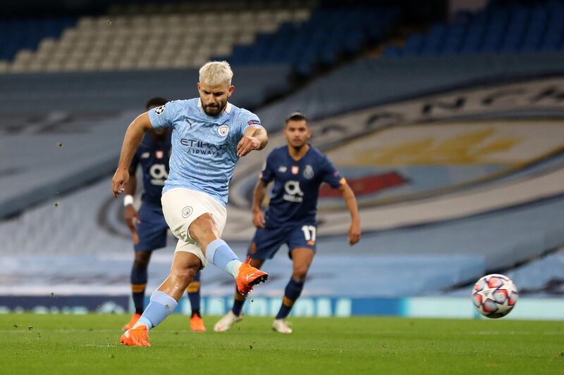 MANCHESTER, ENGLAND - OCTOBER 21: Sergio Aguero of Manchester City scores his team's first goal from the penalty spot during the UEFA Champions League Group C stage match between Manchester City and FC Porto at Etihad Stadium on October 21, 2020 in Manchester, England. Sporting stadiums around the UK remain under strict restrictions due to the Coronavirus Pandemic as Government social distancing laws prohibit fans inside venues resulting in games being played behind closed doors. (Photo by Martin Rickett - Pool/Getty Images)