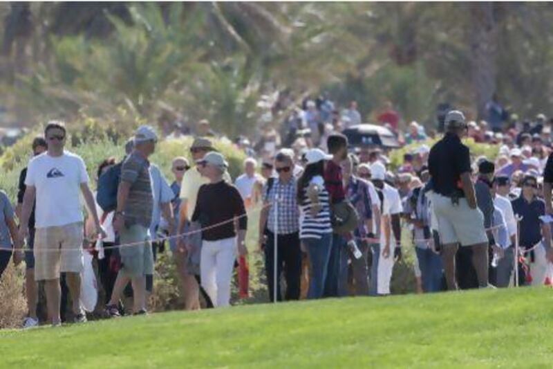Golf fans lined the fairways and putting greens just to catch a glimpse of Tiger Woods and Rory McIlroy in action during the first two rounds of the Abu Dhabi HSBC Golf Championship.