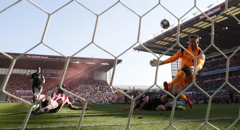 Liverpool's Simon Mignolet saves a shot from Stoke City's Saido Berahino. Liverpool beat Stoke 2-1 on Saturday. Carl Recine / Reuters