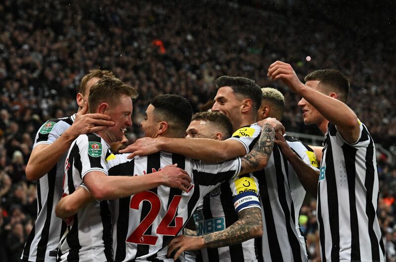 Newcastle United's Sean Longstaff celebrates with teammates after scoring his team's second goal. AFP