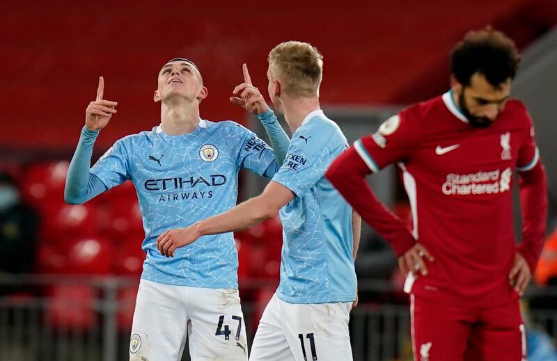 City's Phil Foden, left, celebrates scoring their fourth goal. Reuters