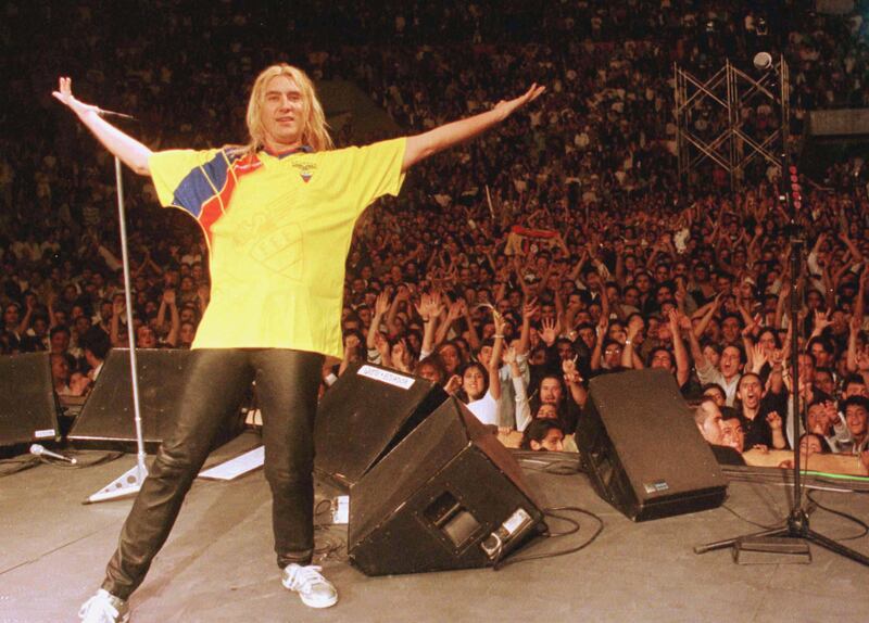 Def Leppard lead singer Joe Elliott wearing an Ecuadorean football shirt during a concert in Quito, April 15, 1997. Reuters
