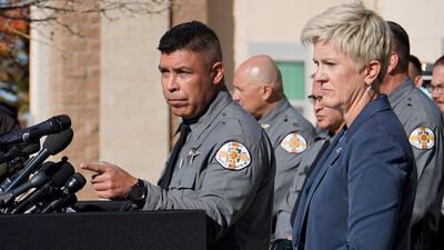 Santa Fe County Sheriff Adan Mendoza with District Attorney Mary Carmack-Altwies speaking to the media. AFP
