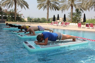 Doing core exercises while balancing on water is a great way to get fit while still having fun. Courtesy Float DXB