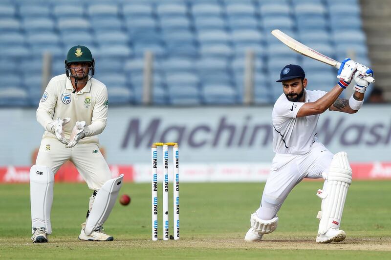Indian captain Virat Kohli, right, plays a shot. AFP