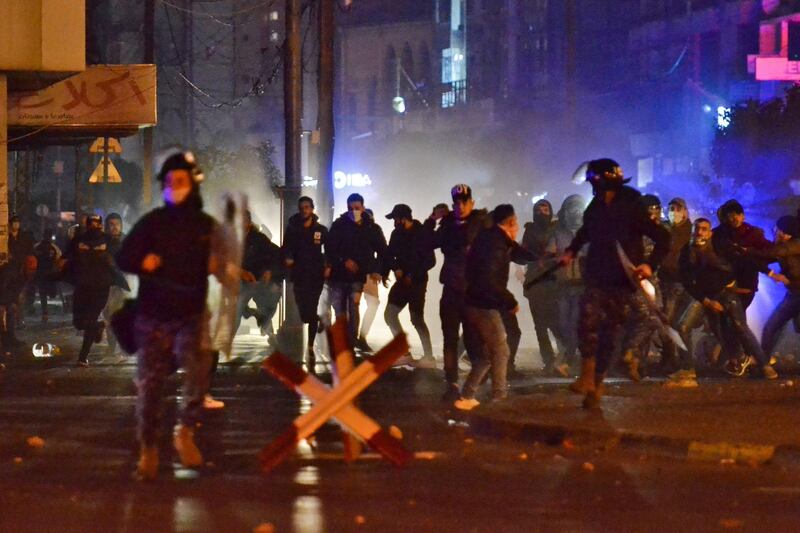 Lebanese anti-government protesters clash with security forces following a demonstration against dire economic conditions, in the northern city of Tripoli. AFP