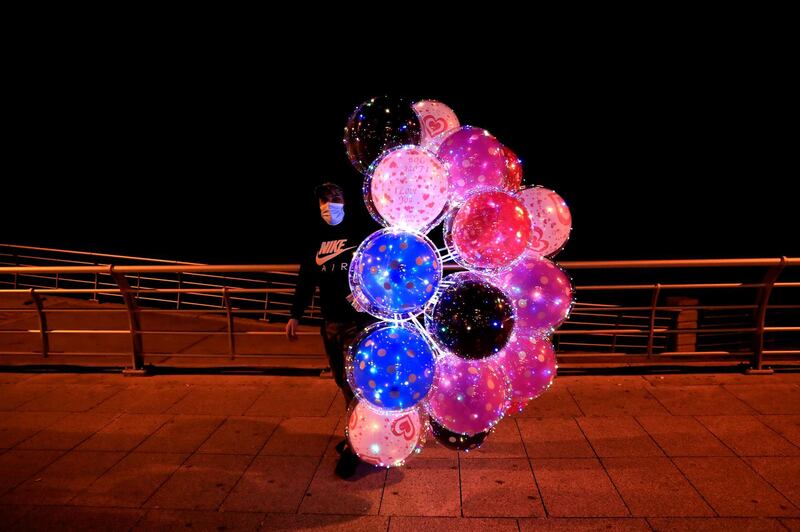 A street vendor sells colored balloons at Beirut's seaside corniche along the Mediterranean Sea, in Beirut, Lebanon. AP Photo