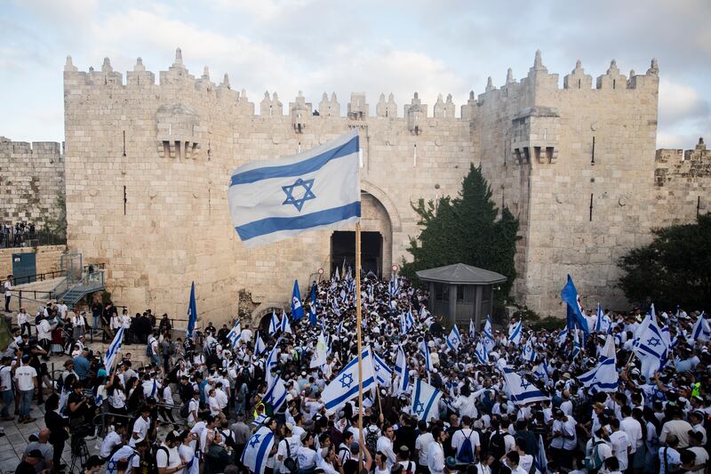 Israeli marching into Jerusalem's old city muslim quarter on May 18, 2023 in Jerusalem. Getty.