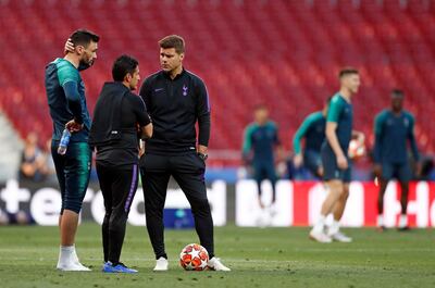 Tottenham coach Mauricio Pochettino speaks to Tottenham goalkeeper Hugo Lloris, left, during a training session at the Wanda Metropolitano stadium in Madrid, Friday May 31, 2019. English Premier League teams Liverpool and Tottenham Hotspur are preparing for the Champions League final which takes place in Madrid on Saturday night. (AP Photo/Bernat Armangue)