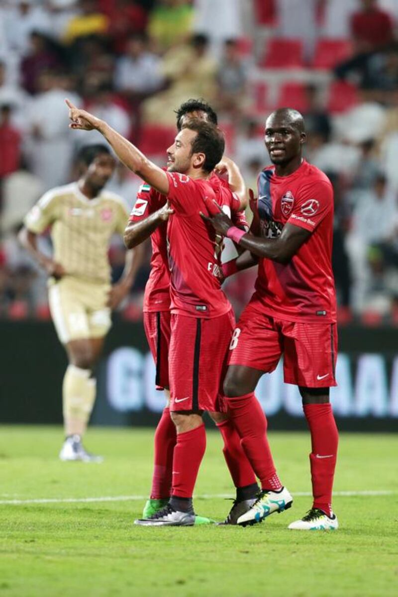 Members of Al Ahli celebrate scoring against Al Shaab during their Arabian Gulf League match, the final one of the season, at Rashid Stadium in Dubai on May 8, 2016. Christopher Pike / The National