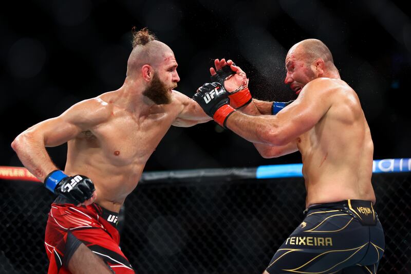 Glover Teixeira and Jiri Prochazka exchange strikes during their fight at UFC 275. Getty