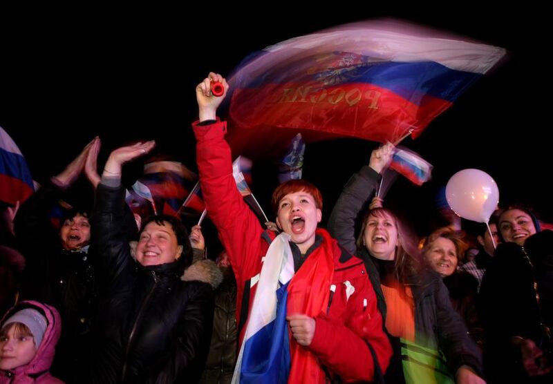 People react after the end of a referendum in Sevastopol, Crimea, Ukraine, 16 March 2014. Credit: EPA/Zurab Kurtsikidze