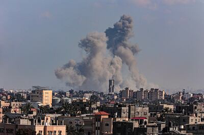 Smoke billowing over Khan Younis in the southern Gaza Strip during Israeli bombardment. AFP 