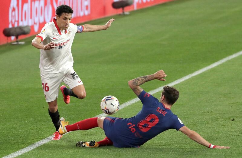 Sevilla's Jesus Navas in action against Atletico's Saul Niguez. EPA