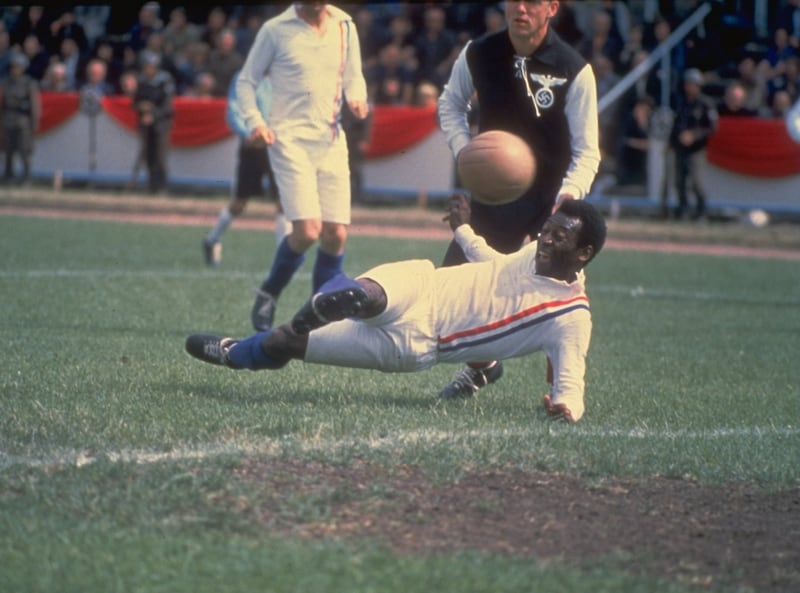 Pele scores the equalising goal for the Allied Prisoners Of War, during the match against Germany, in the 1981 film 'Escape to Victory'. Reuters