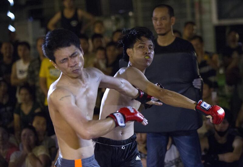 Thai amateur fighters fighting during the 'Fight Club Thailand' group's underground fighting activity, in Bangkok. Fight Club Thailand is an underground group organizing illegal, unauthorised street fights which go against Thailand's 1999 Boxing Act. Police are investigating and trying to prosecute the group for their allegedly violation of the law. EPA