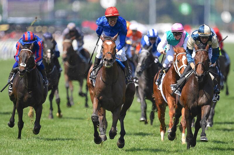 Jockey Kerrin McEvoy aboard Godolphin's Cross Counter celebrates after winning the annual Melbourne Cup, the world's richest two-mile handicap, at Flemington Racecourse in Melbourne, Australia. Associated Press