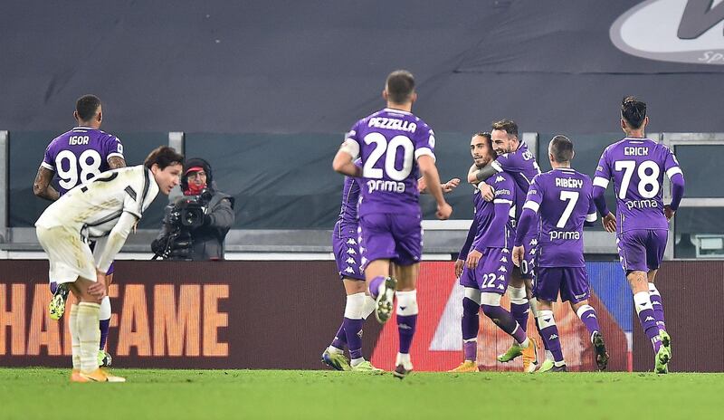 Fiorentina's Martin Caceres celebrates with teammates after scoring the third goal against Juventus. EPA