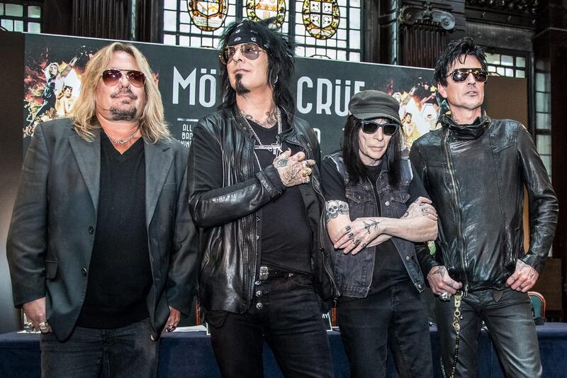 Members of the rock band Motley Crue, from left, Vince Neil, Nikki Sixx, Tommy Lee and Mick Mars pose for photographers after a press conference in London, Tuesday, June 9, 2015. The band announced their European dates for their last ever tour. Vianney Le Caer /Invision / AP