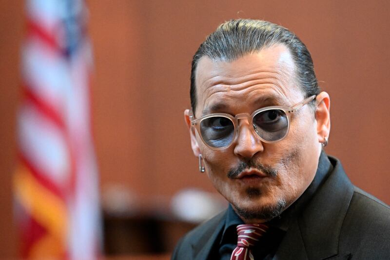Actor Johnny Depp arrives for the 13th day of the trial. AP