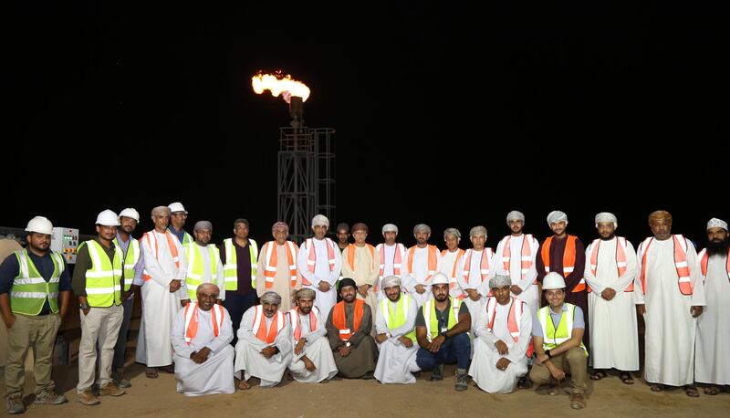 Staff from the new Mazoon Dairy in Oman in front of a new flaring tower for the facility's biogas plant. The plant will start production by the end of the month and aims to produce more than 200 million litres of dairy products by 2026. Courtesy Mazoon Dairy Company