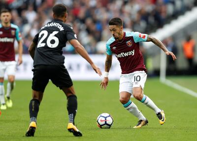 Soccer Football - Premier League - West Ham United vs Swansea City - London Stadium, London, Britain - September 30, 2017  West Ham United's Manuel Lanzini in action with Swansea City's Kyle Naughton    REUTERS/Hannah McKay  EDITORIAL USE ONLY. No use with unauthorized audio, video, data, fixture lists, club/league logos or "live" services. Online in-match use limited to 75 images, no video emulation. No use in betting, games or single club/league/player publications. Please contact your account representative for further details.