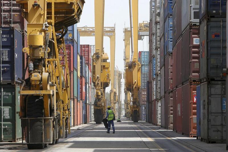 Above, cargo containers Jebel Ali port in Dubai. The 2015 outlook for Dubai’s trade sector dynamics is improving. Pawan Singh / The National