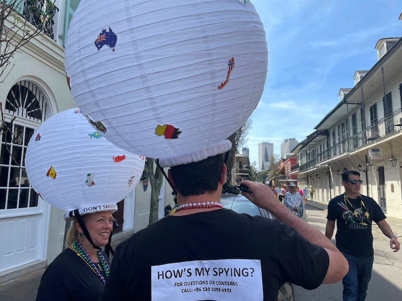 Jerome FitzGibbons of New Orleans walks the streets of the French Quarter on Mardi Gras, dressed as a Chinese spy balloon. AP