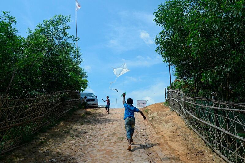 Rohingya refugee children fly kites. AFP