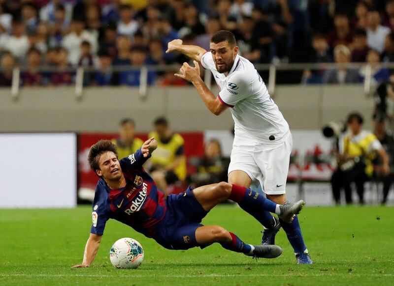 Chelsea's Mateo Kovacic in action with Barcelona's Riqui Puig. Reuters