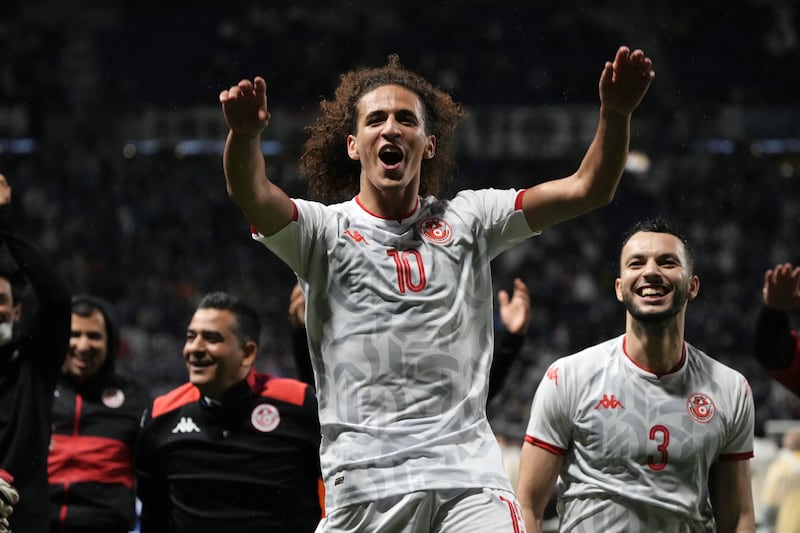 Hannibal Mejbr of Tunisia celebrates his side's 3-0 victory in a friendly against Japan in Osaka on June 14, 2022. Getty