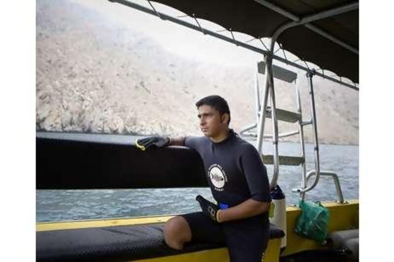 Khalil al Jedaili's legs were crushed but he hasn't let his disability stop him enjoying his favourite sport, diving.