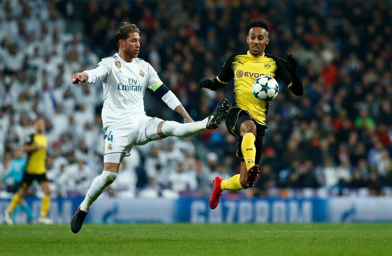 MADRID, SPAIN - DECEMBER 06: Pierre-Emerick Aubameyang of Borussia Dortmund is challenged by Sergio Ramos of Real Madrid during the UEFA Champions League group H match between Real Madrid and Borussia Dortmund at Estadio Santiago Bernabeu on December 6, 2017 in Madrid, Spain.  (Photo by Gonzalo Arroyo Moreno/Getty Images)