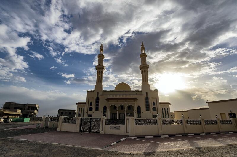 Ras Al Khaimah, United Arab Emirates - Reporter: N/A: The sun sets of a mosque in RAK. Wednesday, April 29th, 2020. Ras Al Khaimah. Chris Whiteoak / The National