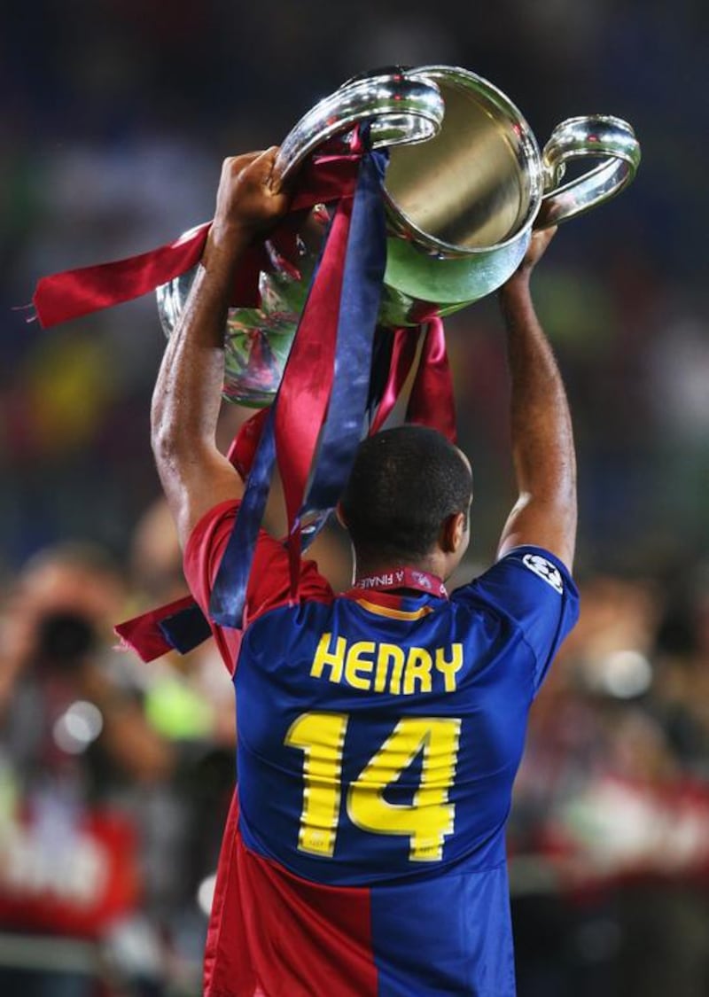 In this May 27, 2009 photo, Thierry Henry of Barcelona lifts the European Cup trophy after winning the Champions League final with Barca against Manchester United at the Stadio Olimpico in Rome. Laurence Griffiths / Getty Images