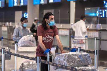 Passengers at the Etihad check-in area at Abu Dhabi International Airport. Victor Besa / The National