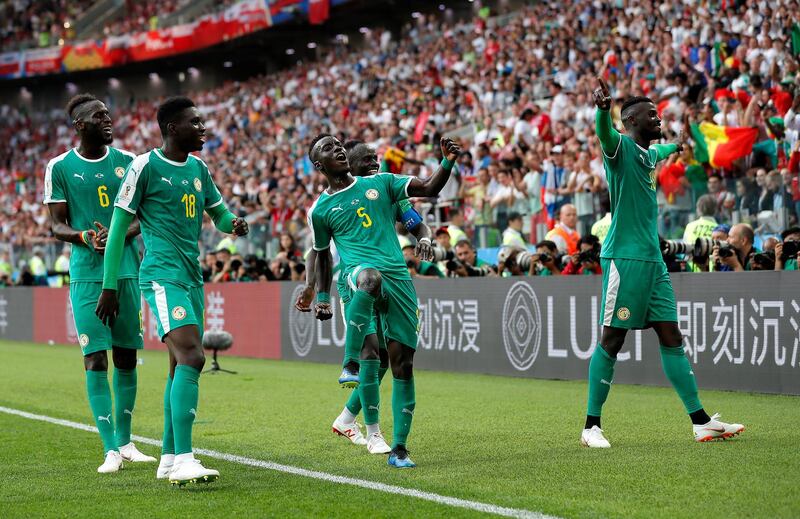 epa06821989 M'Baye Niang of Senegal (R) celebrates with teammates during the FIFA World Cup 2018 group H preliminary round soccer match between Poland and Senegal in Moscow, Russia, 19 June 2018.

(RESTRICTIONS APPLY: Editorial Use Only, not used in association with any commercial entity - Images must not be used in any form of alert service or push service of any kind including via mobile alert services, downloads to mobile devices or MMS messaging - Images must appear as still images and must not emulate match action video footage - No alteration is made to, and no text or image is superimposed over, any published image which: (a) intentionally obscures or removes a sponsor identification image; or (b) adds or overlays the commercial identification of any third party which is not officially associated with the FIFA World Cup)  EPA/YURI KOCHETKOV EDITORIAL USE ONLY  EDITORIAL USE ONLY