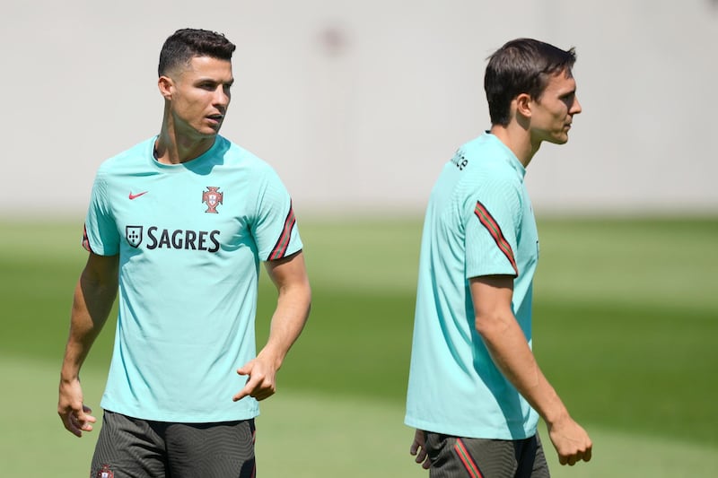 Portugal players Cristiano Ronaldo, left, and Joao Palhinha during training in Budapest on Thursday, June 17. Portugal will face Germany in their next Euro 2020 match on Saturday. EPA