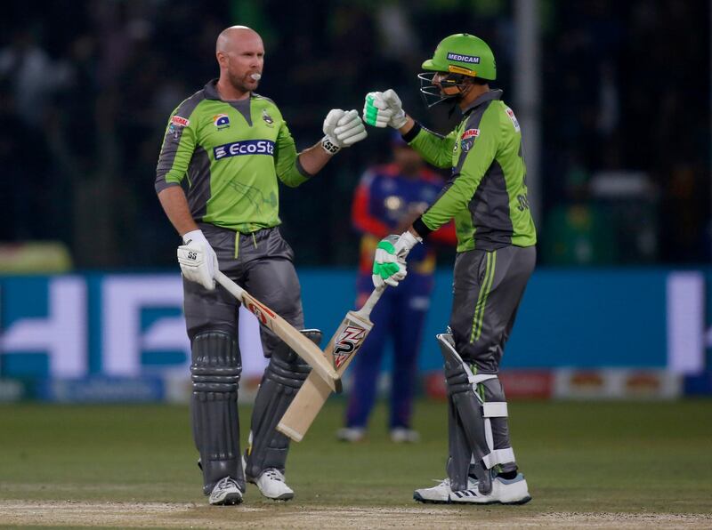 Lahore Qalandars batsmen Ben Dunk, left, and Sohail Akhtar during the Pakistan Super League match against Karachi Kings. AP Photo