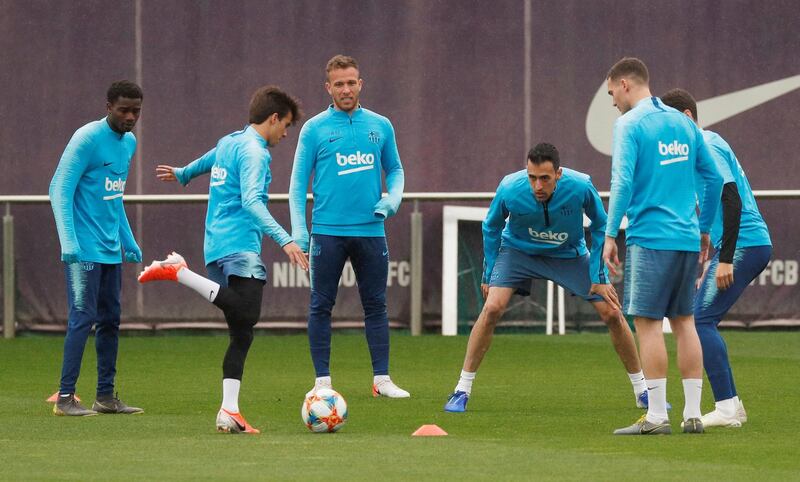 Barcelona's Sergio Busquets with team mates during training. Reuters