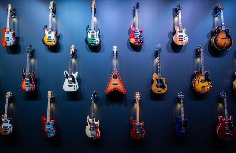 Maton Guitars are displayed on a wall during a media preview of the exhibition 'Maton: Australia's Guitar' at the Powerhouse Museum in Sydney, Australia. EPA