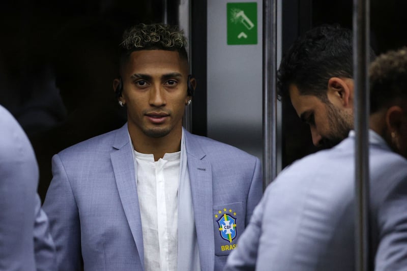 Raphinha and teammates arrive at the Hamad International Airport. AFP