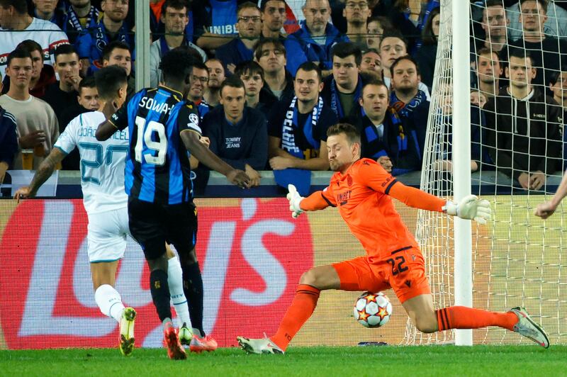 Manchester City's Joao Cancelo sticks the ball through the legs of Brugge goalkeeper Simon Mignolet to make it 1-0. AP