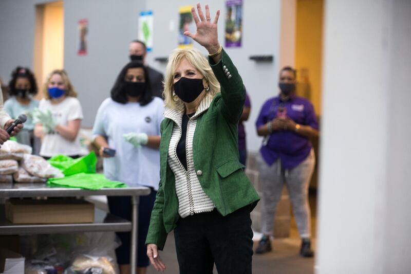 First Lady Jill Biden waves at volunteers as she arrives at the Houston Food Bank. AP Photo