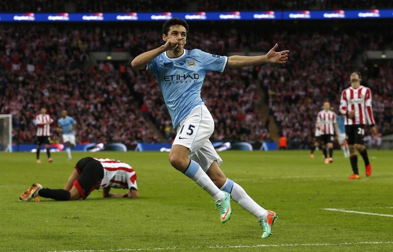 Manchester City's Jesus Navas reacts after scoring his side's final goal in a 3-1 win over Sunderland in the League Cup final on March 2, 2014. Suzanne Plunkett / Reuters