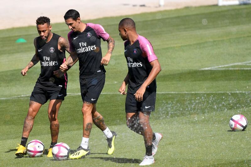 Argentine midfielder Angel di Maria, centre, Neymar and Mbappe take part in a training session. AFP