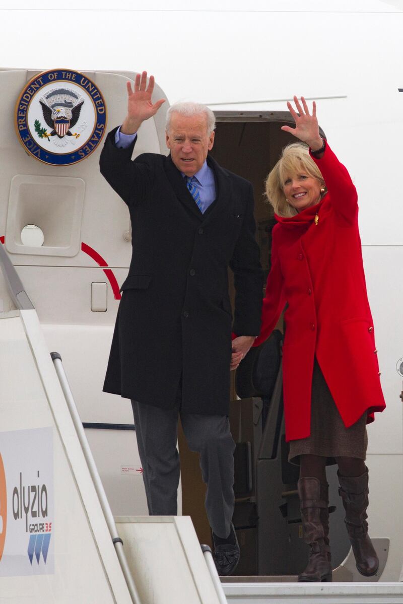 epa03567067 US Vice President Joe Biden (L) and his wife Jill Biden (R) exit Air Force Two as they land at Orly airport as part of Joe Biden's first official visit to Paris, France, 03 February 2013.  EPA/JACQUES BRINON / POOL MAXPPP OUT