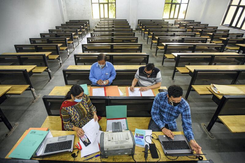 NEW DELHI, INDIA - OCTOBER 12: Faculty members make arrangements to address any student's queries during the online admission process for academic year 2020-21, at Ramjas College, North Campus, on October 12, 2020 in New Delhi, India. On the first day of admissions for merit-based undergraduate courses, Delhi University (DU) received over 19,000 applications to various colleges. (Photo by Amal KS/Hindustan Times via Getty Images)