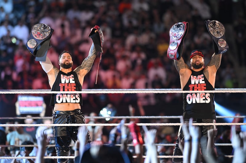 The Usos with their Undisputed WWE Tag Team Championship titles.
